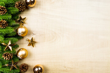 christmas ball and pine tree with xmas decoration on wooden background