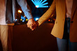 © Nomad_Soul - Love couple holding hands in night amusement park