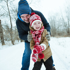 Dad and son play catch-up on a winter day.