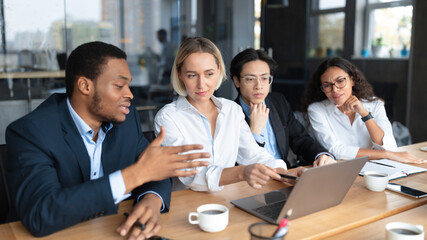 Business Team Working Together At Laptop Discussing Work In Office