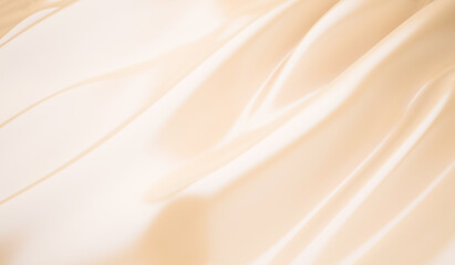 Smooth elegant golden silk wedding background closeup of rippled cream silk fabric lines