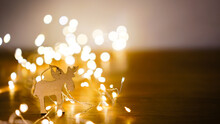 Wooden Reindeer Bokeh Background, New Year Concept, Copy Space

