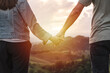 © Kittiphan - Happy young couple traveler relaxing and looking at the beautiful sunset on the top of mountain