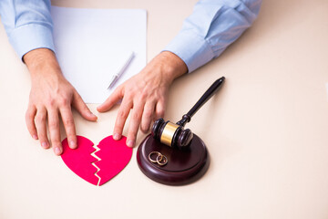 Wall Mural - Young man in courthouse in divorcing concept