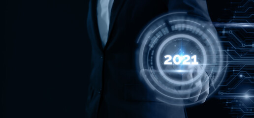 2021 futuristic tehcnology trend concept, hand man pointing in concept futuristic in 2021 coming year the year of artificial intelligence ,big data, iot, augmented reality, machine learning