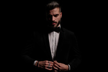 Sexy Confident Man Buttoning Black Velvet Tuxedo
