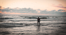 Man On Sunset Sea Beach