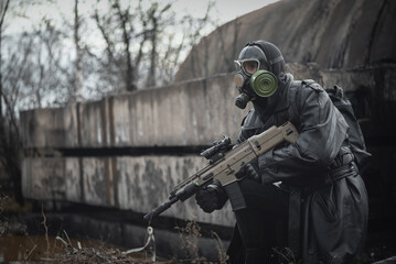 Wall Mural - Post apocalypse soldier with a rifle concept.