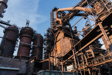 Blast Furnace Of Metallurgical Plant Or Chemical Factory, Large Steel Industrial Buildings And Pipelines.