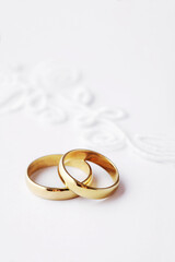 wedding rings. white flowers. symbol of love