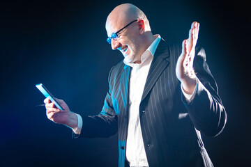 Poster - happy man with a tablet in his hands. a satisfied man is talking via video calling. call using video
