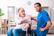 © Elnur - Old man in wheel-chair and young bad caregiver indoors