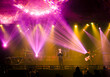 © ravipat - High performance singer on stage in concert lighting on stage, Concert stage with lights and musical instruments during rock concert. Lights rays in dark on stage. Performance on stage