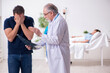 © Elnur - Young husband visiting sick wife in the clinic