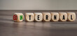 Cubes, dice or blocks showing the words external and internal on wooden background