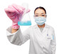 © Syda Productions - medicine, science and healthcare concept - asian female doctor or scientist wearing face protective medical mask and goggles holding flask with chemical or cure over white background