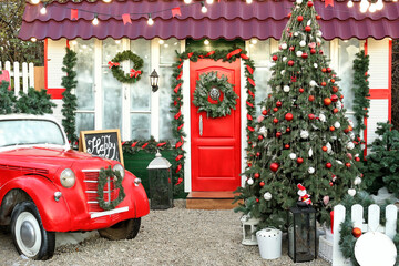 Wall Mural - Car and fir tree near house decorated for Christmas