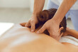 © Studio Romantic - Young woman enjoying relaxing remedial body massage done by professional masseur