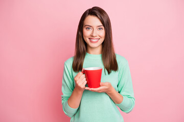 Sticker - Photo of relax cheerful brunette straight hair girl hold cup wear pastel sweater isolated on pink color background