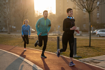 Sticker - Jogging and running are fitness recreations. Happy group of friends exercising together.