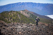 man running up the hill over stones on canary islands
