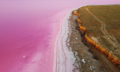 Beautiful landscape on the shores of a pink lake that has healing properties and a natural pink color.