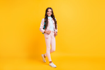 Canvas Print - Full length photo of charming joyful schoolgirl wear rucksack good mood isolated on yellow color background