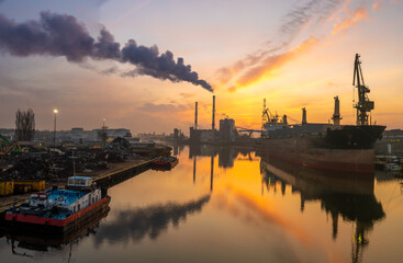 Wall Mural - panorama of the industrial landscape - a smoking power plant, a bulk cargo ship in a shipyard, a scrap recycling station