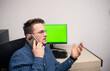 © FarukPhotography - Young caucasian businessman in blue shirt is talking on phone with someone. Businessman is trying to help someone to solve the problem.