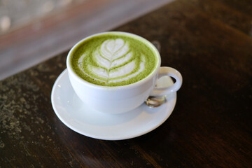 Wall Mural - hot japanese matcha green tea with latte art.