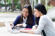 © 9nong - Happy asian woman college student studying in university campus with her classmate or tutor, concept of back to school, video call online learning class, teleeducation, online education lifestyle