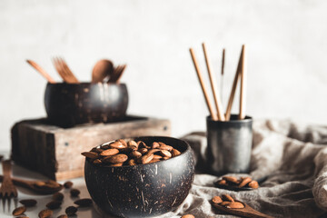 Coconut bowls containing almonds. 