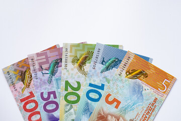 New Zealand banknotes on white background.