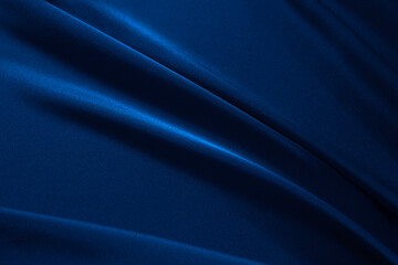 navy blue elegant abstract background. silk satin fabric with nice folds. beautiful dark blue backgr