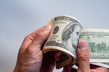 Wall Mural - Dollars banknotes on white background.