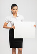 © krishna - Cheerful attractive young business women holding white board on white.