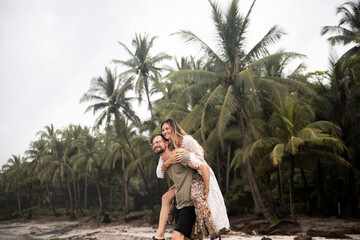 young couple on honeymoon at beach of costa rica