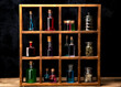 Close up of witch shelves with potion bottles. Medieval alchemist laboratory with various kind of flasks. Esoteric, gothic and occult background.

