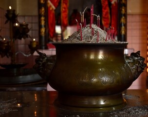 Wall Mural - Golden incense bowl on a shrine at a Chinese temple with Gong Shan Hong (temple, mountain, food) written on it