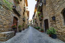 Street Of An Old Medieval Town With Stone Houses And Cobbled Floors, Street Lamps And An Atmosphere Of Bygone Times.
