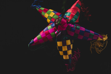 Wall Mural - Portrait of a Colorful Mexican Pinata, black background