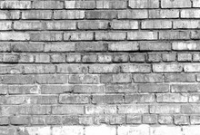 Grunge Shabby Black White Brick Wall Background. Aged Wall Texture. Weathered Brickwork. Grungy Stonewall Background. Rough Texture Block Wall.
