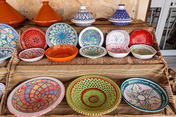 Bright colorful plate for souvenir in the street market in Tunisia. traditional Tunisian ceramics