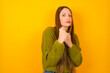 © Roquillo - Young beautiful Caucasian woman wearing green sweater against yellow wall Ready to fight with fist defense gesture, angry and upset face, afraid of problem.