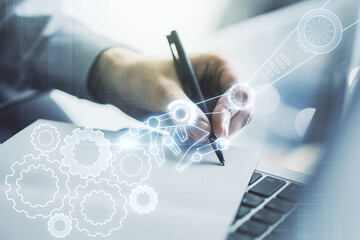 Poster - Double exposure of robotics technology hologram and hand writing in notebook on background with laptop. Research and development software concept