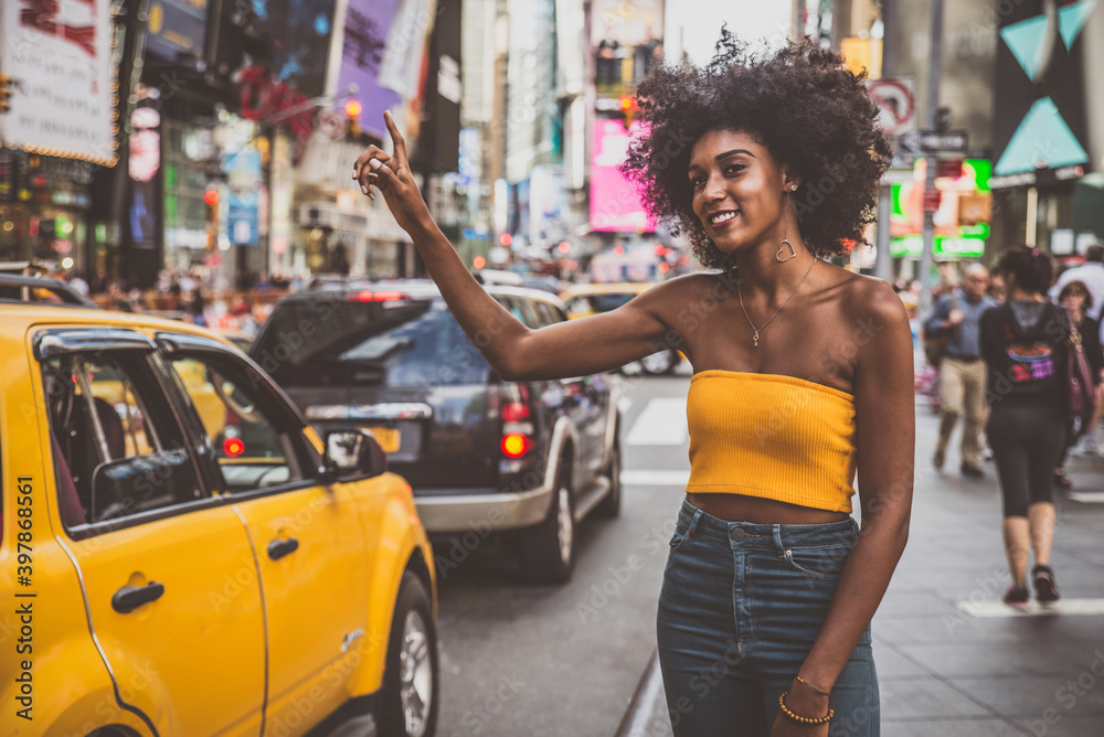 Young beautiful girl walking in Time square, manhattan. Lifestyle concepts about New york