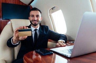 Businessman flying on his private jet.