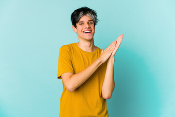 Young caucasian skinny man expressing emotions isolated on blue background