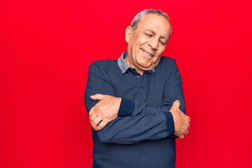 Sticker - Senior man with grey hair wearing casual polo hugging oneself happy and positive, smiling confident. self love and self care