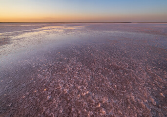  Sunset on the Genichesk pink extremely salty lake (colored by microalgae with crystalline salt depositions), Ukraine.